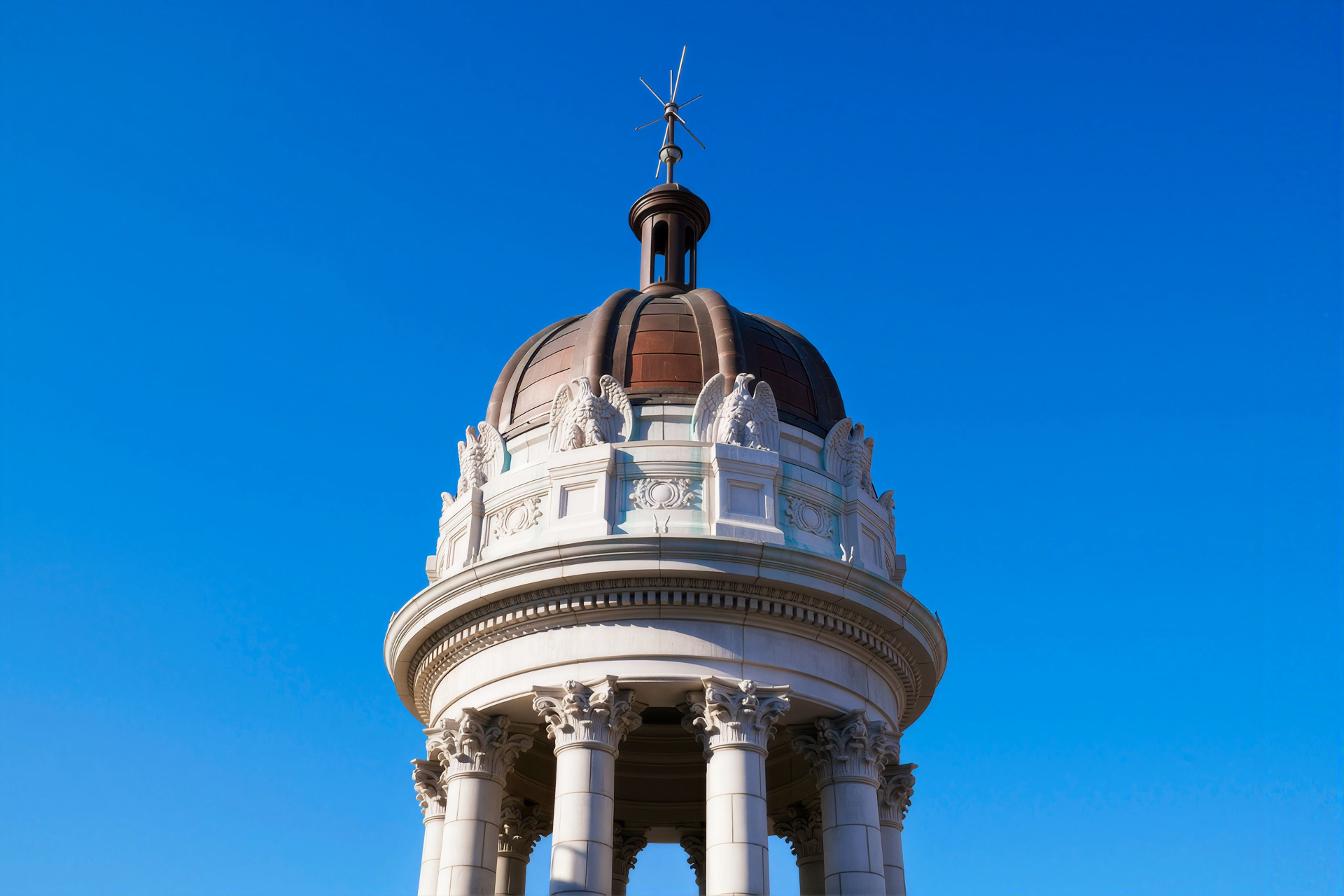 Restored rooftop cupola and copper spire of the Jarmulowsky Bank Building at Nine Orchard in Manhattan.