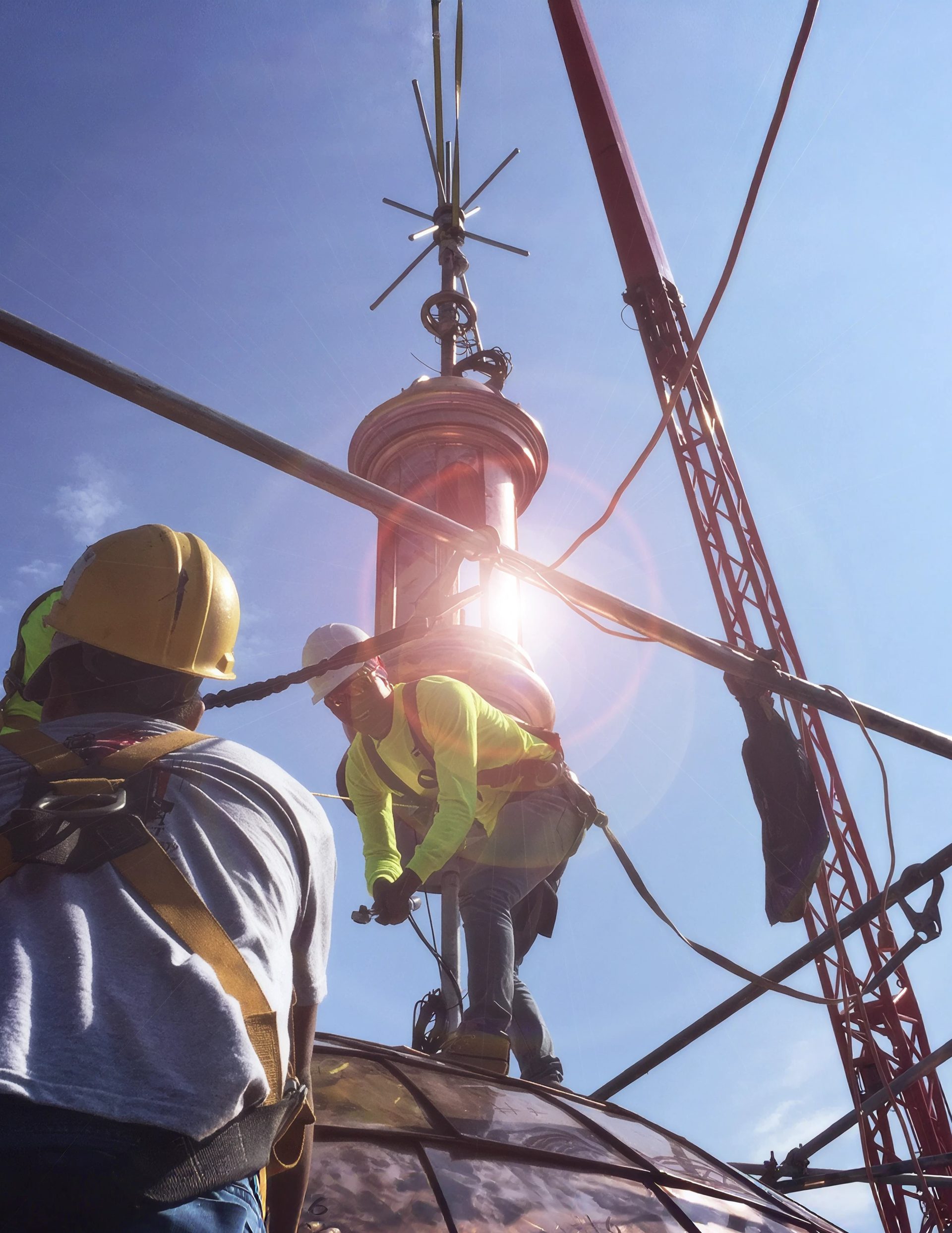 Copper cupola hoisted into position at 9 Orchard Street on the Lower East Side, Manhattan
