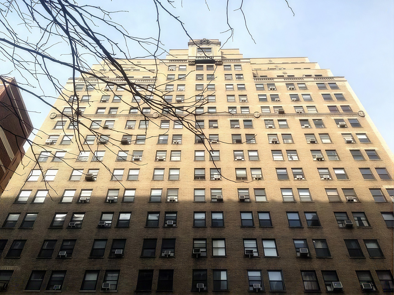 Buff brick elevation and terra cotta pediment at 253 West 72nd Street, Upper West Side
